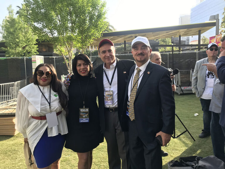 2 women and 2 men standing