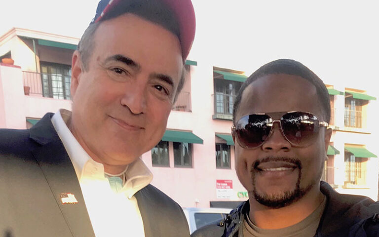 close up of 2 men smiling